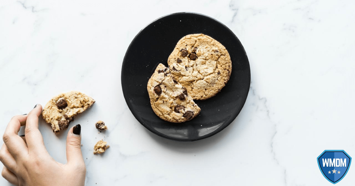 Cookies. Cookies sitting on a plate with a hand reaching to grab one.